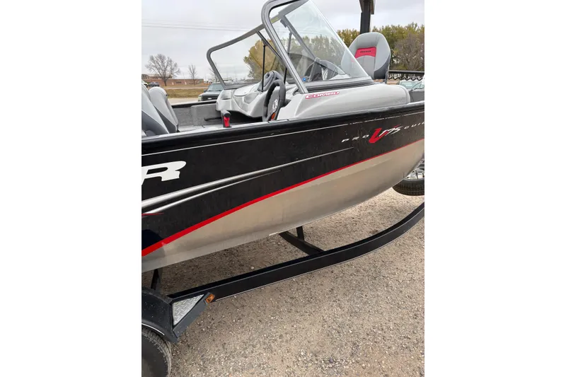 Slide: The Image of 2013 Tracker Pro Guide V-175 Combo boat on trailer, side view. - 10
