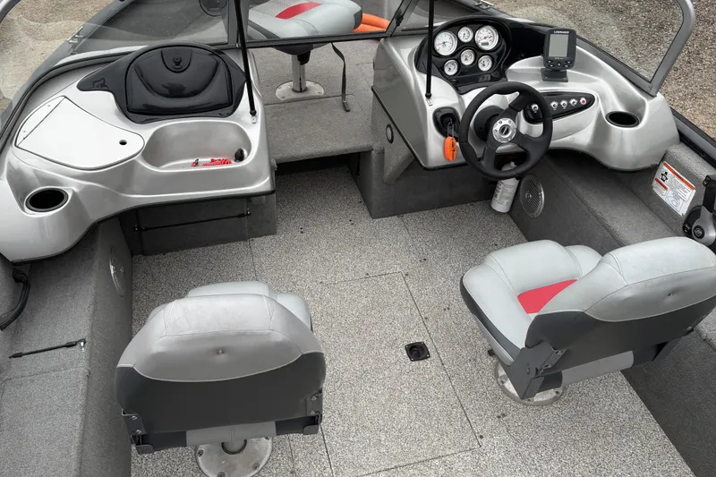 Slide: The Image of 2013 Tracker Pro Guide V-175 Combo boat interior with steering console and seating. - 12