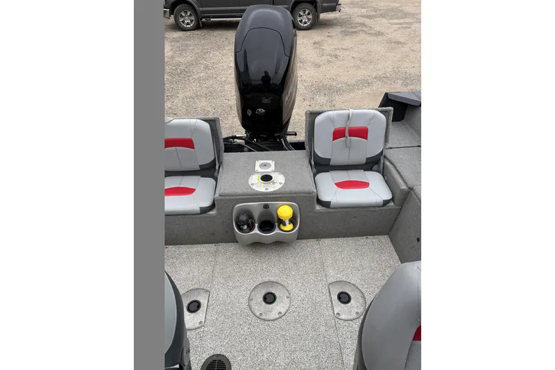 Slide: The Image of 2013 Tracker Pro Guide V-175 Combo boat interior with seating and motor. - 13
