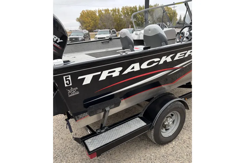 Slide: The Image of 2013 Tracker Pro Guide V-175 Combo boat on trailer, side view. - 9