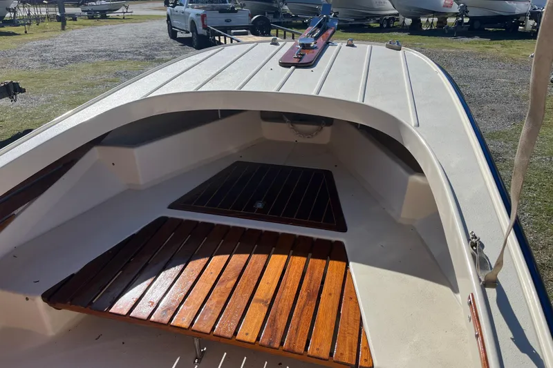 Slide: The Image of 1971 Boston Whaler 21 Outrage boat interior with wooden deck details. - 4
