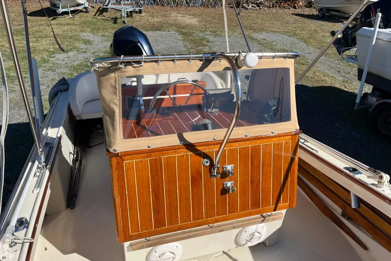 Slide: The Image of 1971 Boston Whaler 21 Outrage boat with wooden console and steering wheel. - 7