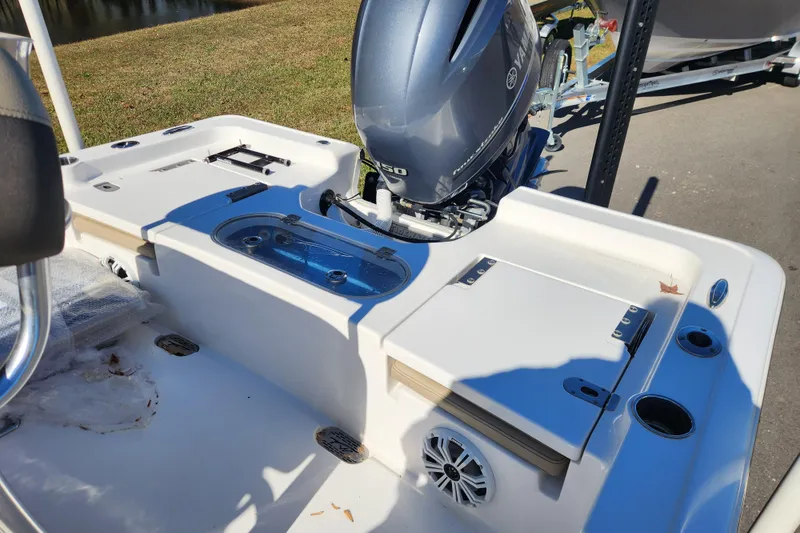 Slide: The Image of 2021 Tidewater 2110 Bay Max boat with Yamaha outboard motor, featuring a clean deck layout. - 12