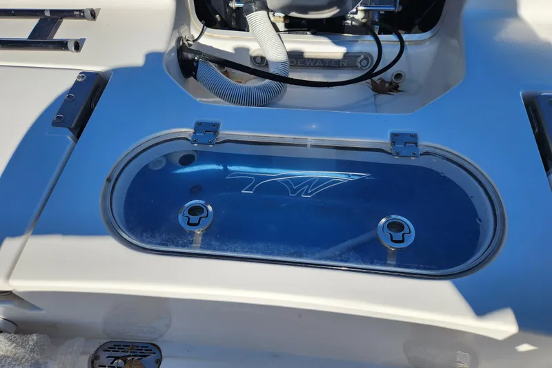 Slide: The Image of 2021 Tidewater 2110 Bay Max boat livewell with transparent lid and logo. - 13