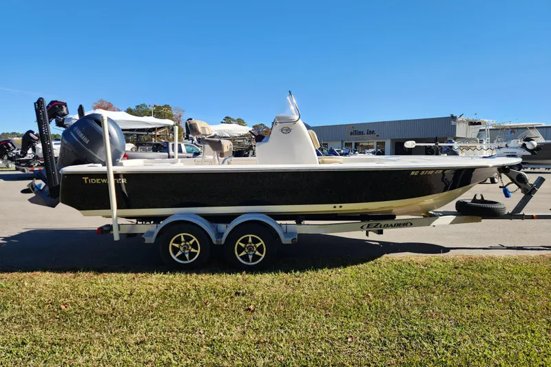 Slide: The Image of 2021 Tidewater 2110 Bay Max boat on trailer, parked outdoors. - 5