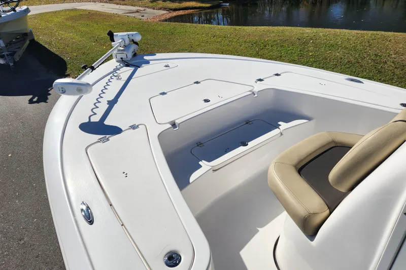 Slide: The Image of 2021 Tidewater 2110 Bay Max boat with seating and storage compartments. - 7
