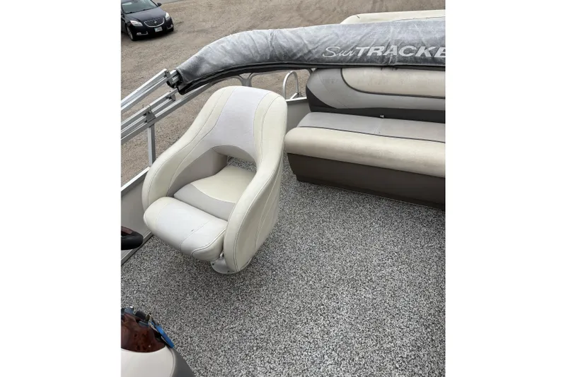 Slide: The Image of 2004 Sun Tracker Party Barge 25 I/O Regency Edition interior with white seating. - 10