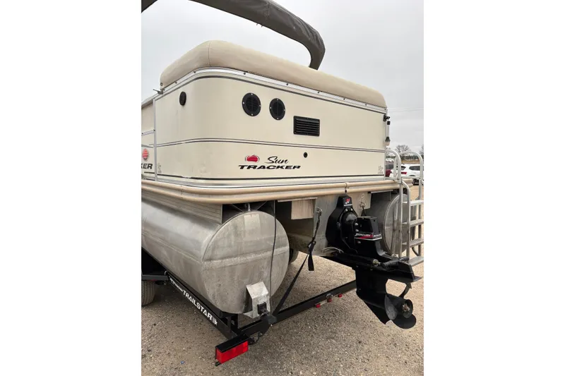 Slide: The Image of 2004 Sun Tracker Party Barge 25 I/O Regency Edition, rear view with Mercury outboard motor. - 5
