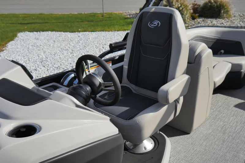 Slide: The Image of 2026 Barletta Cabrio 22QC boat interior with steering wheel and captain's chair. - 3