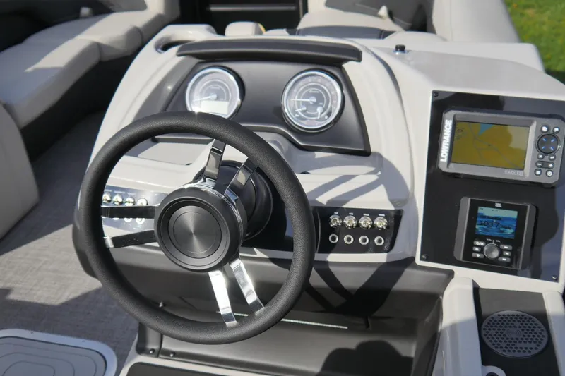 Slide: The Image of 2026 Barletta Cabrio 22QC boat dashboard with steering wheel and navigation system. - 4