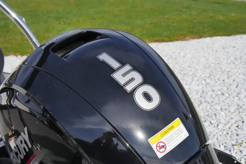 Slide: The Image of Close-up of a Mercury 150 outboard motor on a 2026 Barletta Cabrio 22QC boat. - 8