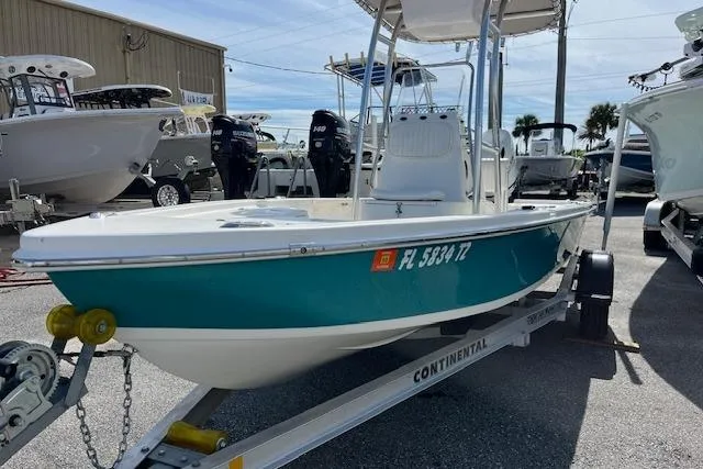 The Image of 2024 Palmetto 186 boat on trailer, displayed outdoors at a dealership. - 0