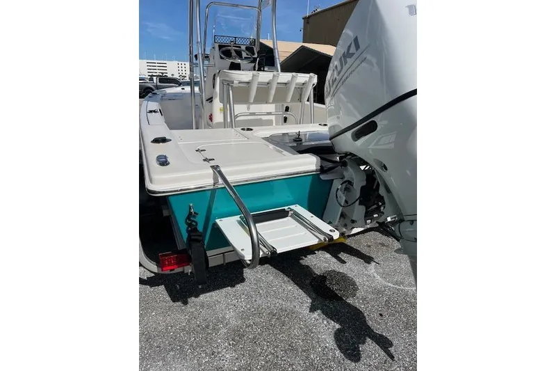 Slide: The Image of 2024 Palmetto 186 boat with Suzuki outboard motor and swim platform. - 13