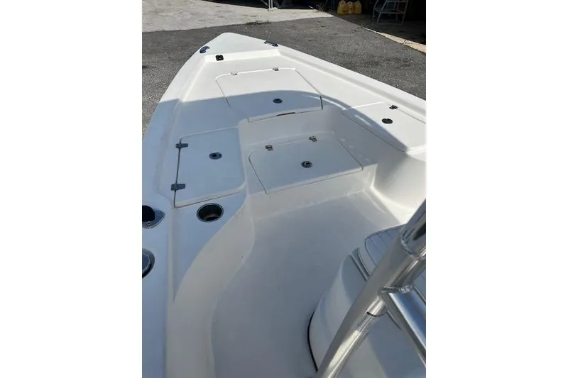 Slide: The Image of 2024 Palmetto 186 boat deck with storage compartments and seating. - 6