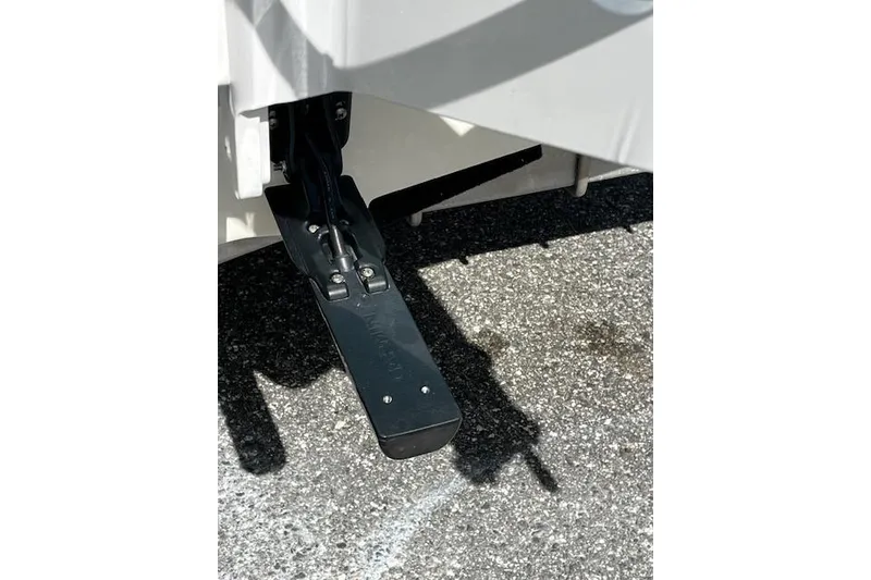 Slide: The Image of 2024 Palmetto 186 boat trim tab on asphalt surface. - 7