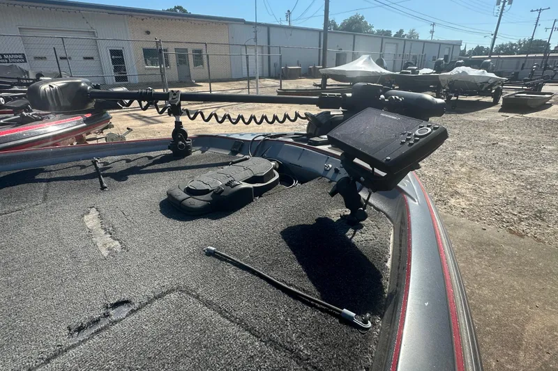 Slide: The Image of 2006 Nitro 482 DC boat deck with mounted equipment in a marina setting. - 12