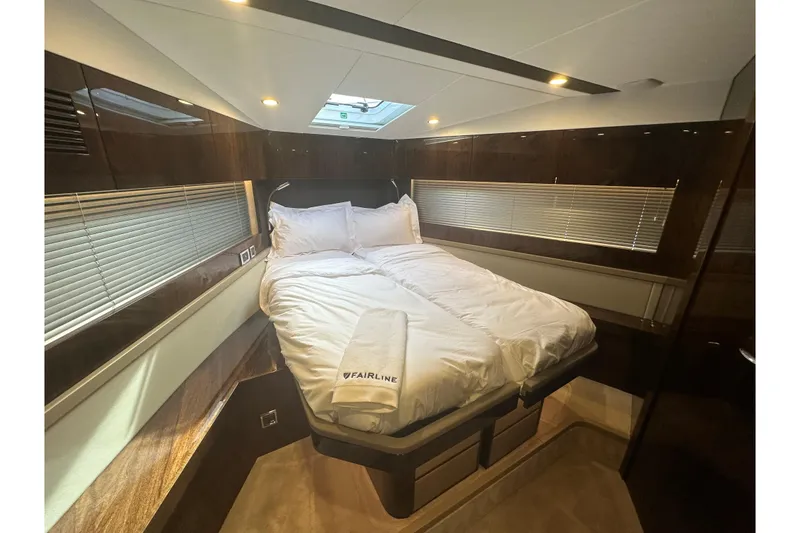 Slide: The Image of Luxurious cabin interior of 2026 Fairline Targa 45 GT yacht with cozy bedding. - 12