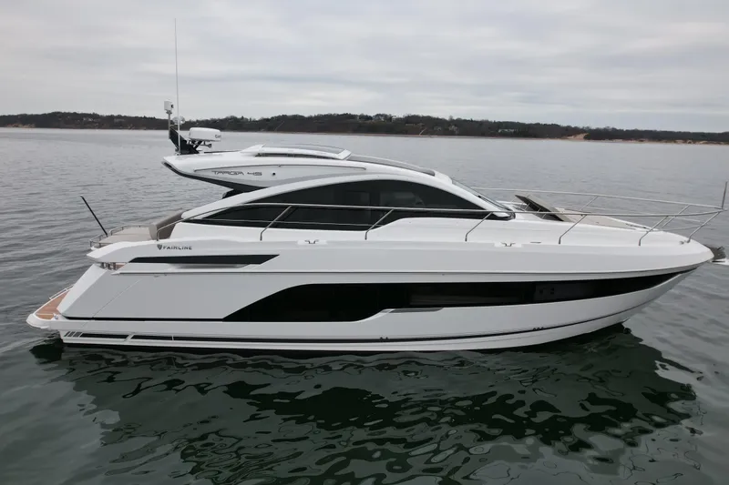 Slide: The Image of 2026 Fairline Targa 45 GT luxury yacht on calm water, side view. - 19