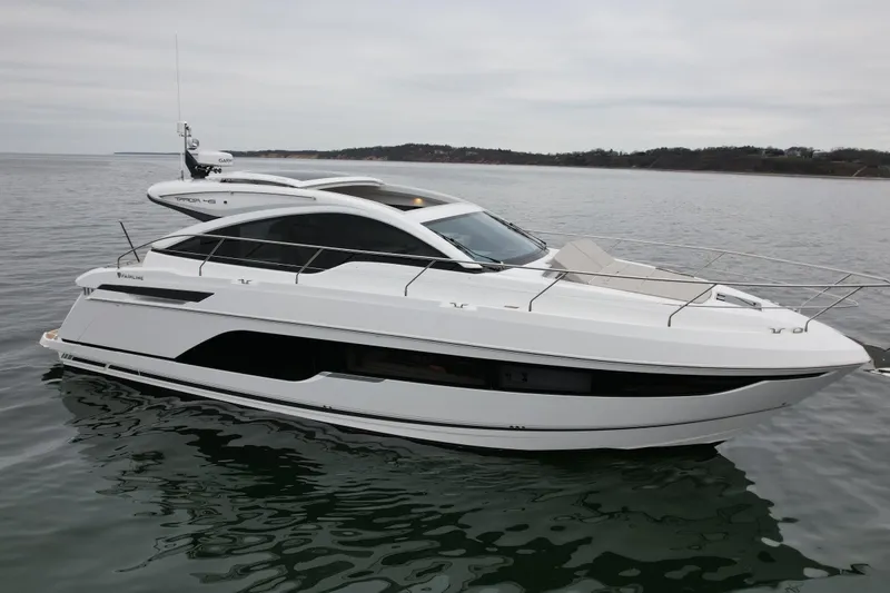 Slide: The Image of 2026 Fairline Targa 45 GT luxury yacht on calm waters. - 2