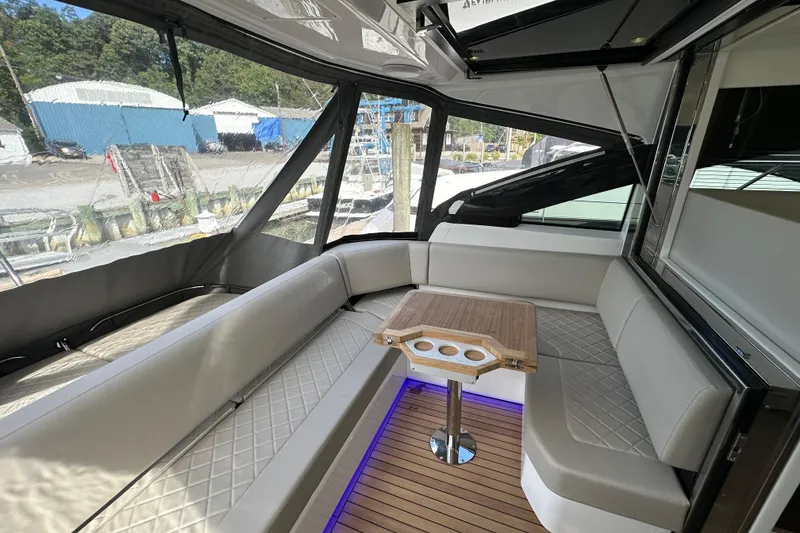 Slide: The Image of 2026 Fairline Targa 45 GT yacht interior with elegant seating and wooden table. - 4