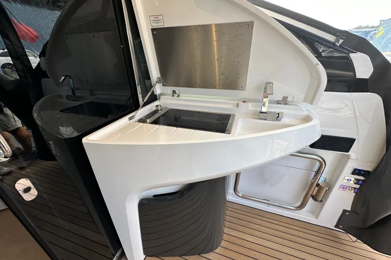 Slide: The Image of Outdoor kitchenette on 2026 Fairline Targa 45 GT yacht with sink and grill. - 5