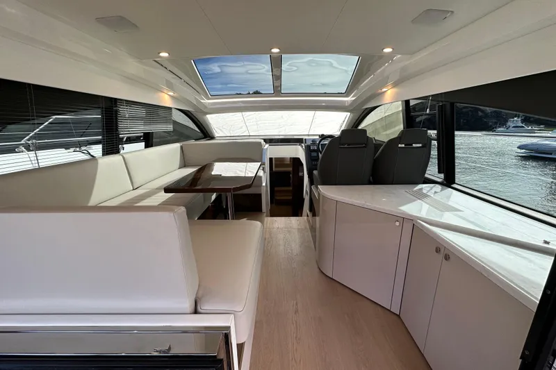 Slide: The Image of Luxurious interior of 2026 Fairline Targa 45 GT yacht with modern seating and panoramic windows. - 6