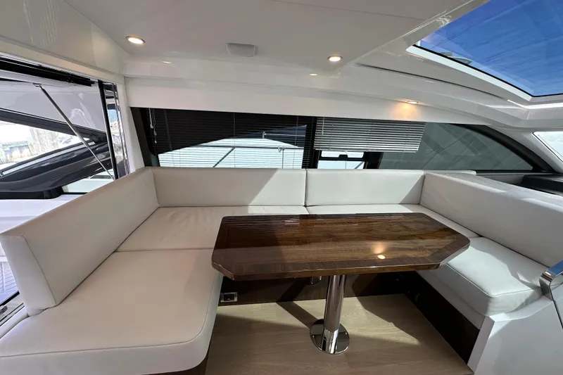 Slide: The Image of Luxurious interior of 2026 Fairline Targa 45 GT yacht with elegant seating and wooden table. - 8