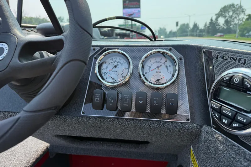 Slide: The Image of Dashboard of 2025 Lund 1675 Adventure Sport boat with gauges and controls. - 12