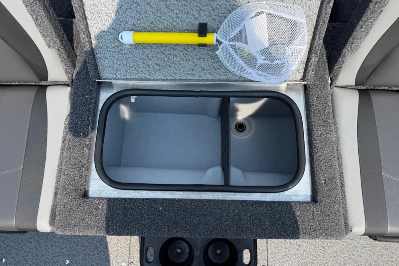 Slide: The Image of 2025 Lund 1675 Adventure Sport boat interior with storage compartment and fishing net. - 14