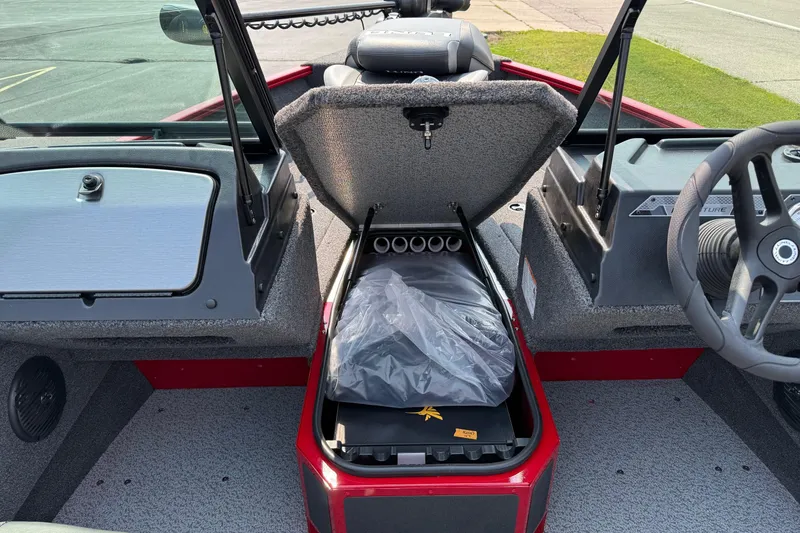 Slide: The Image of 2025 Lund 1675 Adventure Sport boat interior with open storage compartment. - 19