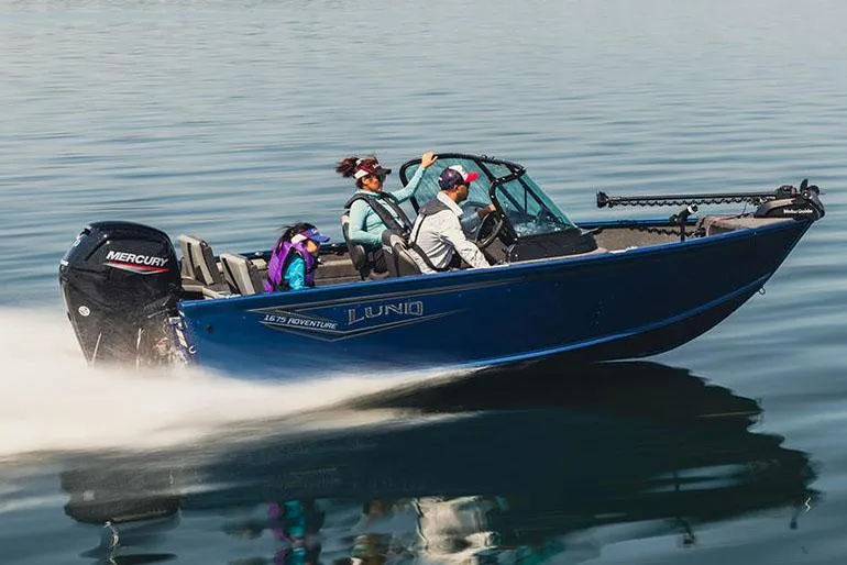 Slide: The Image of Manufacturer Provided Image: 2025 Lund 1675 Adventure Sport boat speeding on calm water. - 26