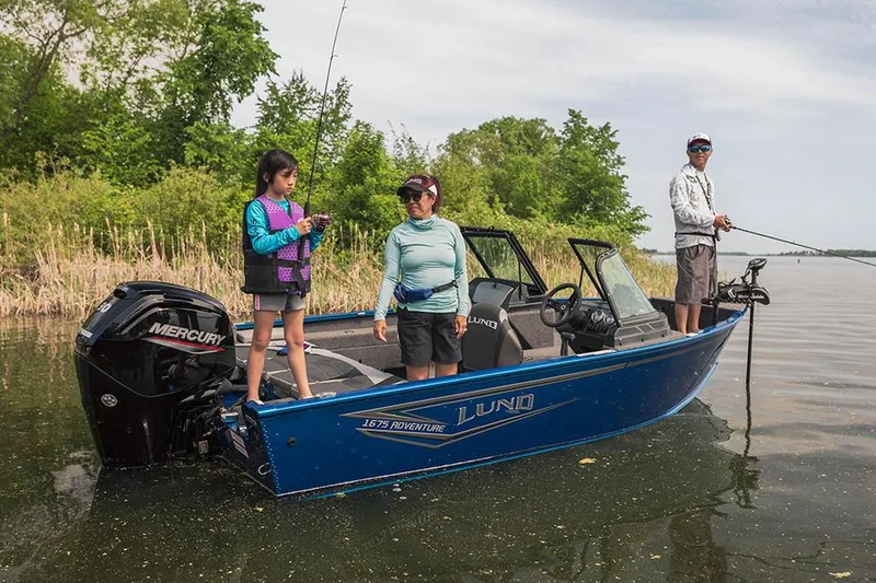 Slide: The Image of Manufacturer Provided Image: Family fishing on a 2025 Lund 1675 Adventure Sport boat in a serene lake. - 27