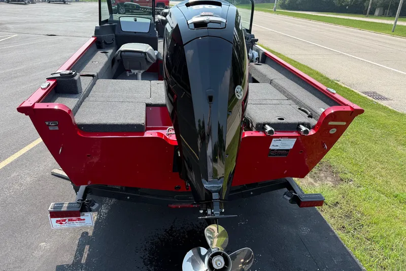 Slide: The Image of 2025 Lund 1675 Adventure Sport boat with powerful outboard motor, red exterior, and spacious interior. - 3