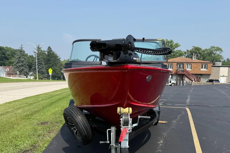 Slide: The Image of 2025 Lund 1675 Adventure Sport boat on trailer, parked outdoors on a sunny day. - 8