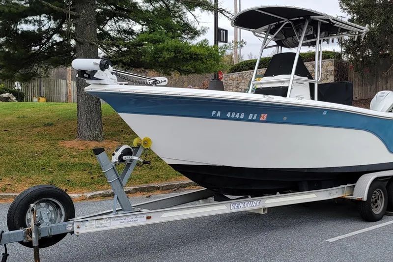 Slide: The Image of 2010 Sea Fox 216 Center Console boat on trailer, parked outdoors. - 1
