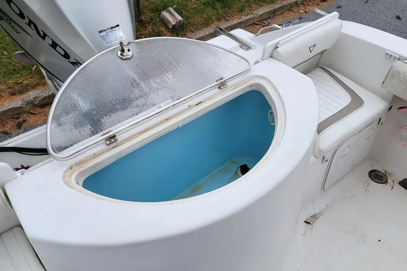 Slide: The Image of Open storage compartment on 2010 Sea Fox 216 Center Console boat. - 14