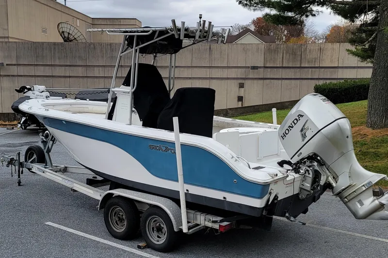 Slide: The Image of 2010 Sea Fox 216 Center Console boat on trailer with Honda outboard motor. - 4