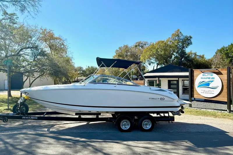 Slide: The Image of 2010 Cobalt 232 boat on trailer at Elite Marine dealership. - 1