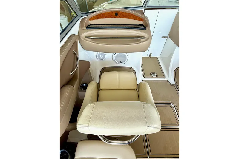 Slide: The Image of Luxurious interior of a 2010 Cobalt 232 boat with beige leather seating. - 27