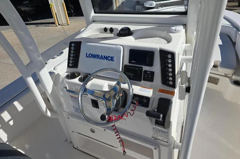 Slide: The Image of 2019 Robalo 246 Cayman boat console with Lowrance electronics and steering wheel. - 16