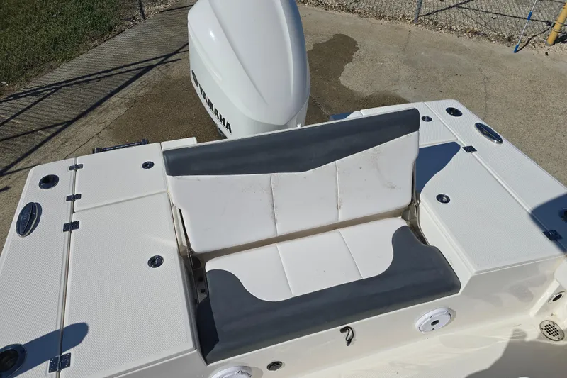 Slide: The Image of 2019 Robalo 246 Cayman boat with Yamaha engine, featuring a cushioned seating area. - 18