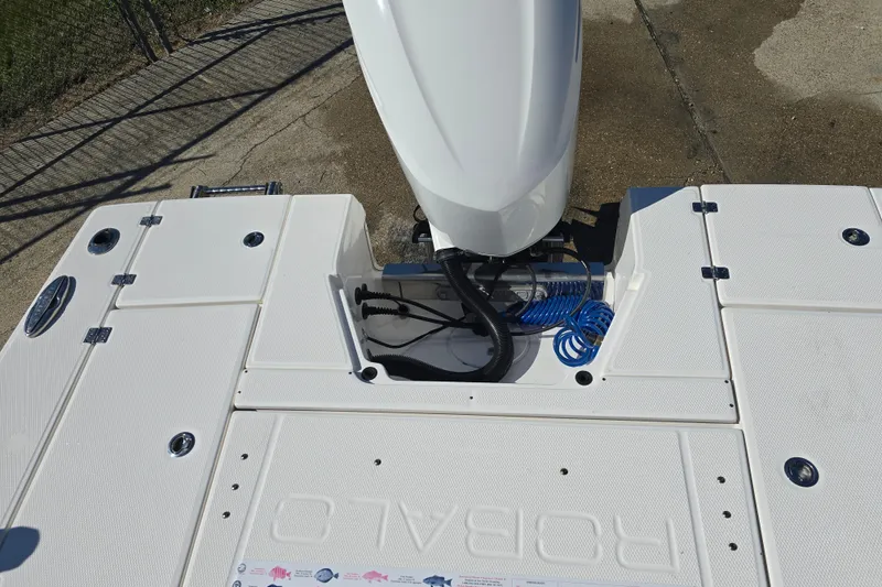 Slide: The Image of 2019 Robalo 246 Cayman boat deck with engine and storage compartments. - 20