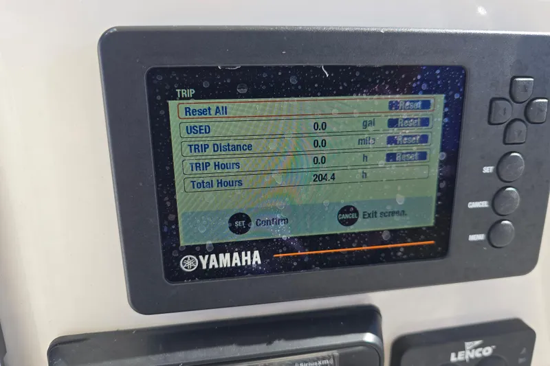 Slide: The Image of Yamaha display on 2019 Robalo 246 Cayman showing trip and total hours. - 23