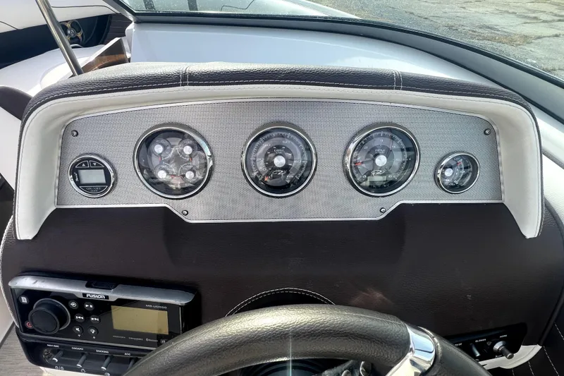 Slide: The Image of Dashboard of 2016 Regal 2300 Bowrider boat with gauges and controls. - 12