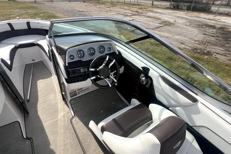 Slide: The Image of 2016 Regal 2300 Bowrider interior with steering wheel and dashboard controls. - 3