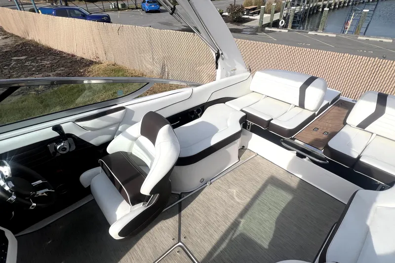 Slide: The Image of 2016 Regal 2300 Bowrider interior with white seating and modern design. - 4