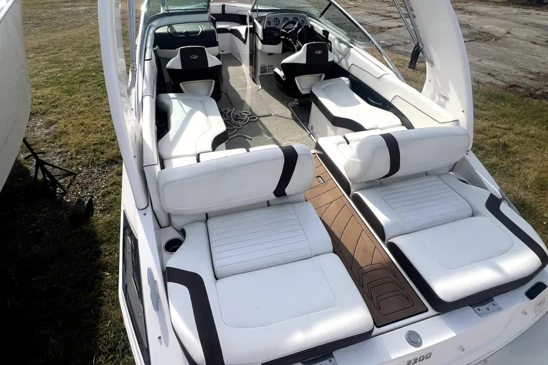 Slide: The Image of 2016 Regal 2300 Bowrider boat with white seating and sleek interior design. - 8