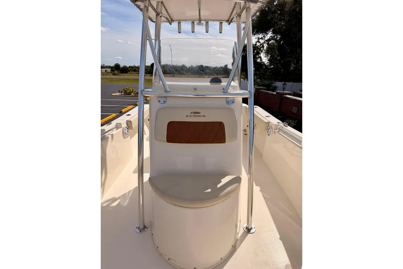 Slide: The Image of 2023 Cobia 220 Center Console boat interior with seating and console view. - 11
