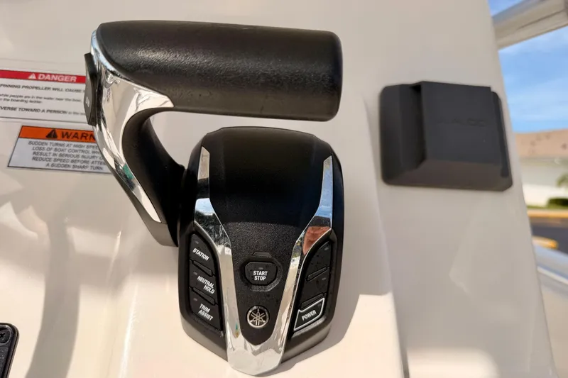 Slide: The Image of Throttle control on 2023 Cobia 220 Center Console boat dashboard. - 20