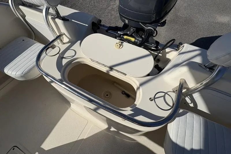 Slide: The Image of 2004 Key West 186 Sportsman boat interior with seating and storage compartment. - 10